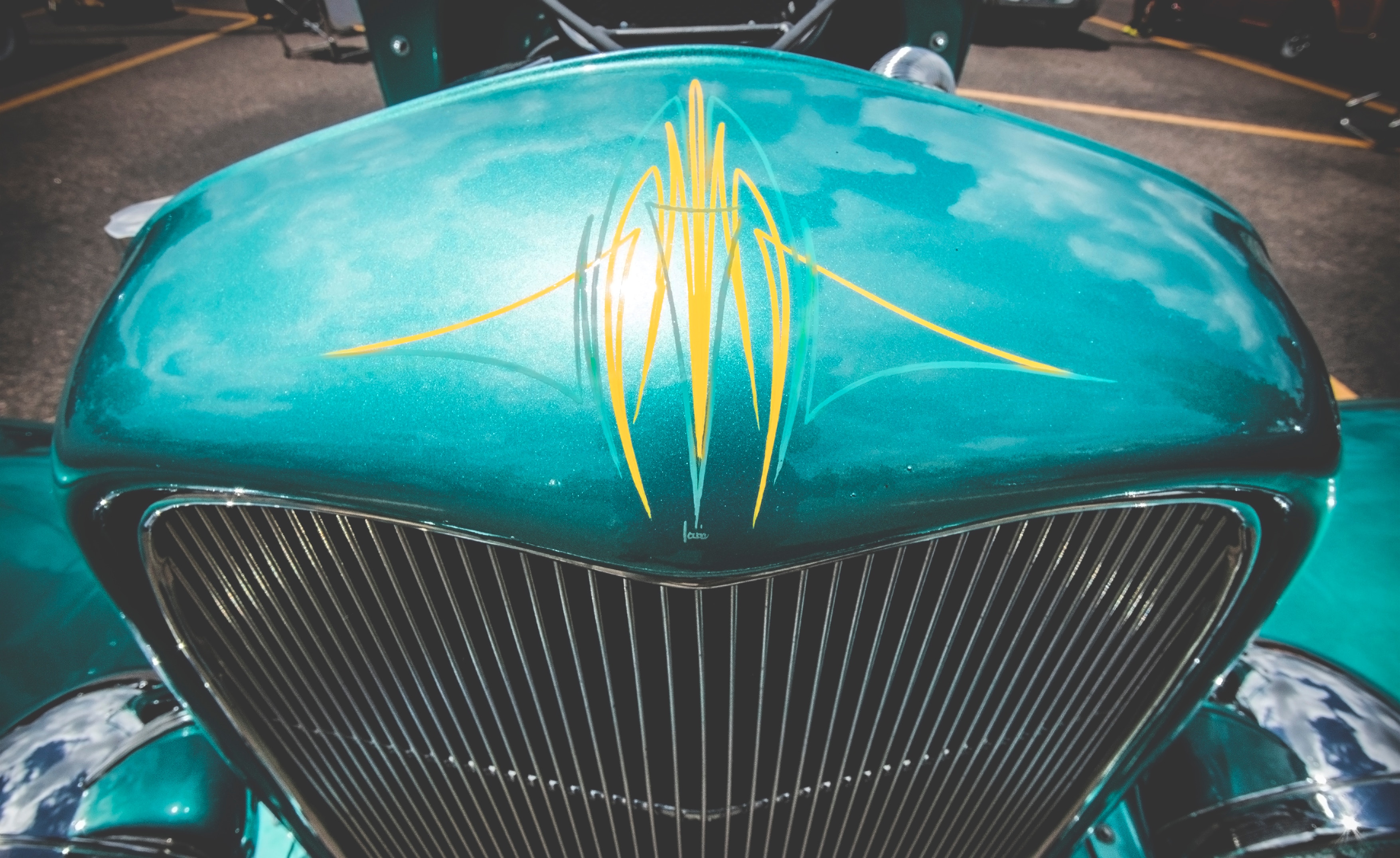 Pinstriping – Custom paintwork on a hot rod.