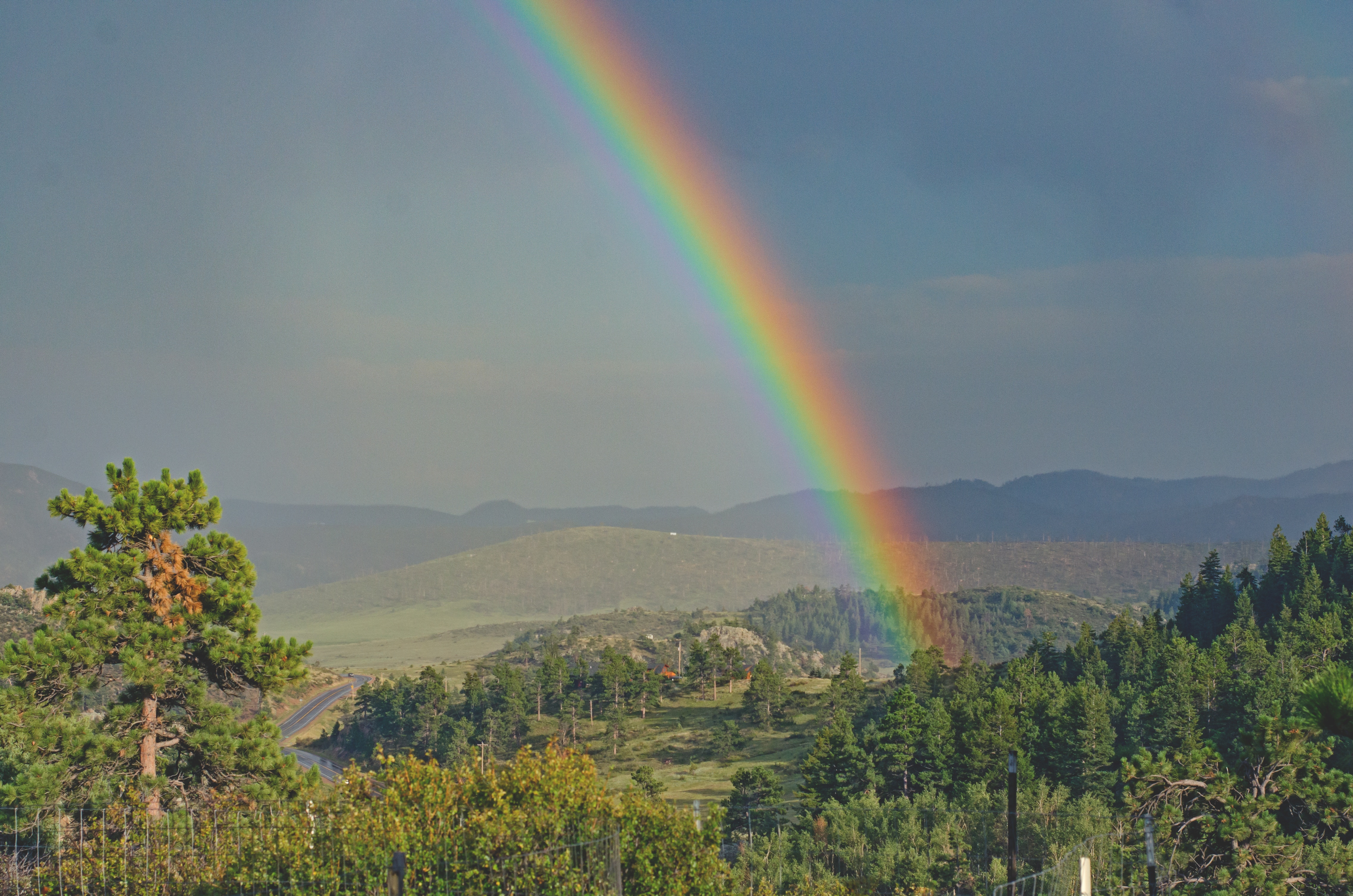 Afternoon Rainbow – We frequently witnessed rainbows forming in the afternoon sky after a passing shower. Never found the pot of gold though.